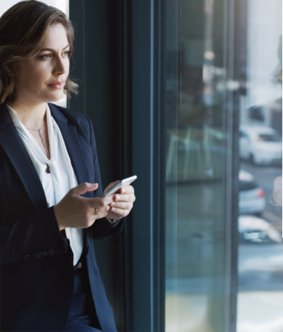 pension plan manager checking portfolio performance dashboard on her phone